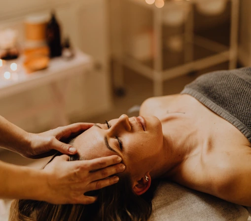 Woman enjoying a relaxing full body massage at a professional spa in Ajman